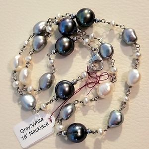 Grey, white pearls. Sterling silver chain, clasp. Mixed types and sizes of pearl